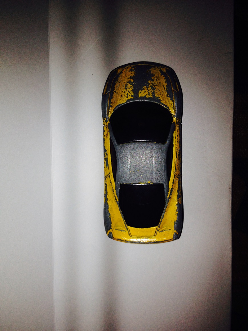 Illustration for article titled Presenting: the most beat-up (but still butt-kicking) 1:64 Ferrari 458 ever